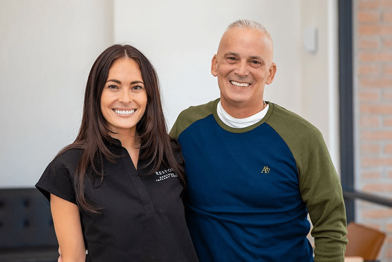 Dental Implant Patient Posing With Dr Mencini After All On 4 Dental Implant Placement