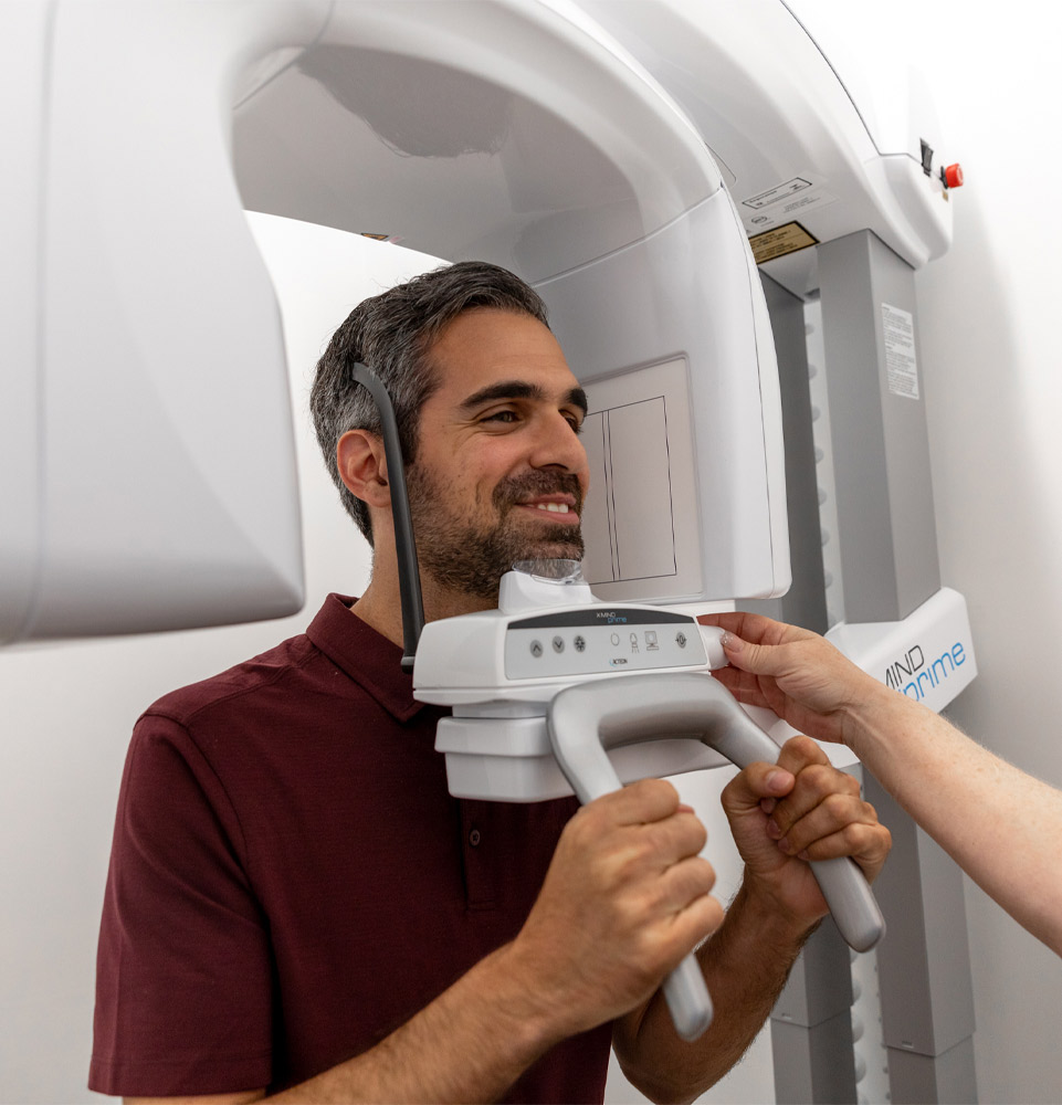 Guy using CBCT Scanner