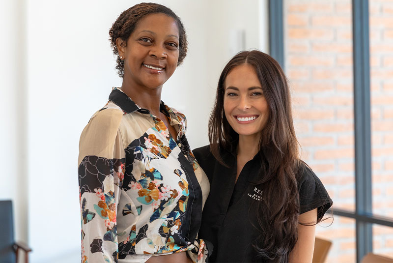 patient and doctor smiling after patient's procedure