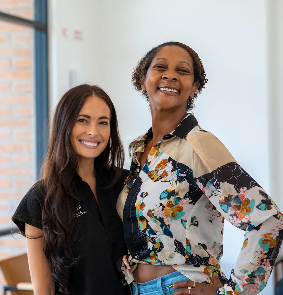 patient and doctor smiling after patient's dental procedure