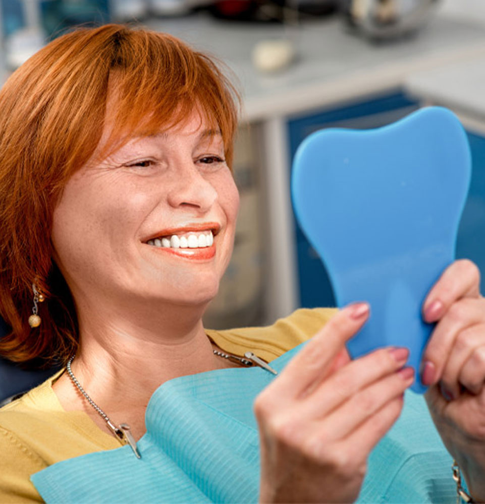 patient smiling after their dental procedure