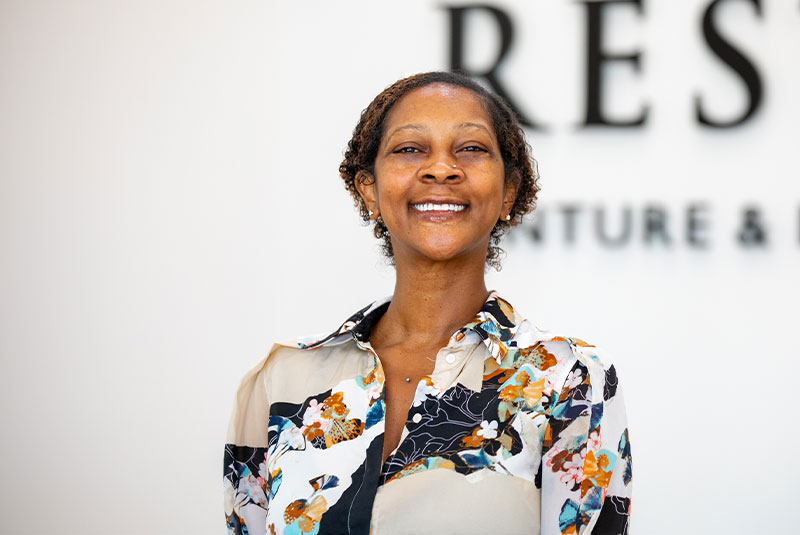 headshot of patient smiling after their dental procedure