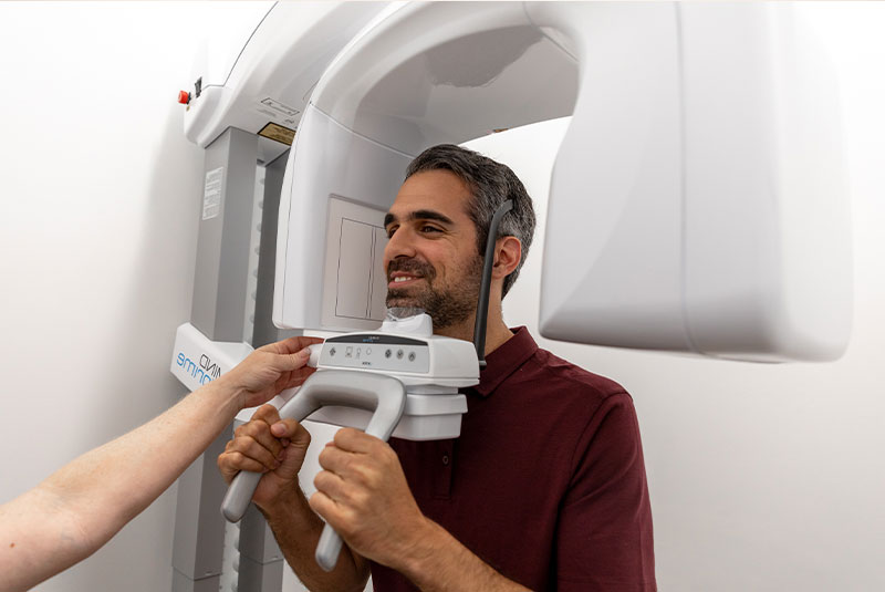 patient under going 3D scan for dental treatment